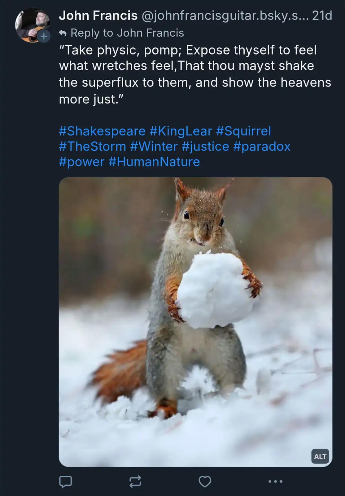 A red squirrel stands upright in a snowy landscape, holding a large, round snowball in its paws. The image is overlaid with…
