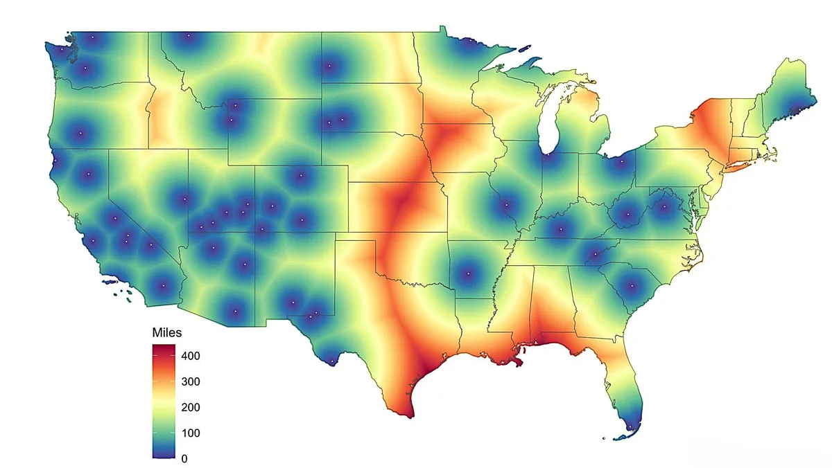 A heat map of the United States showing distance from major cities, with a color gradient from blue (0 miles) to red (400…