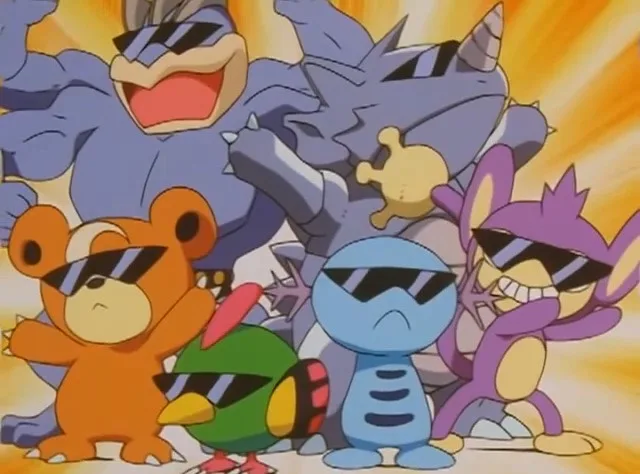 A group of cartoon Pokémon characters, including a large blue dinosaur, a bear, a bird, a blue fish-like creature, and a…