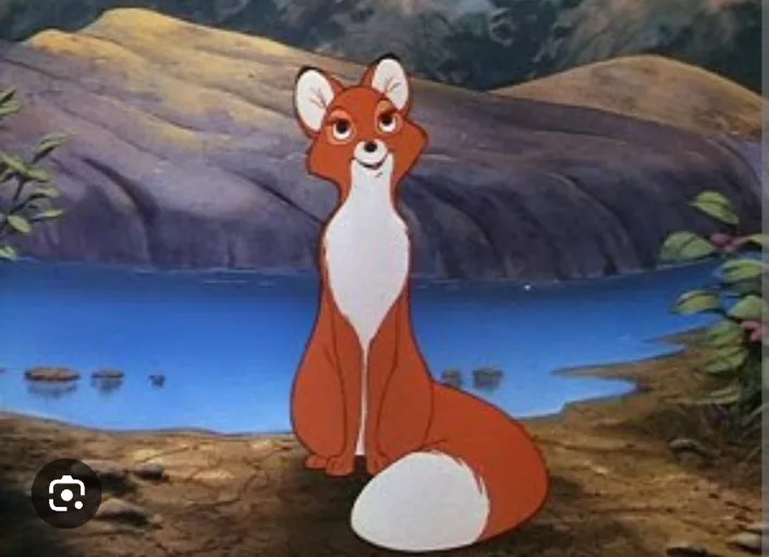 A cartoon fox with orange fur and a white chest and tail sits by a lake with mountains in the background. The fox has a…