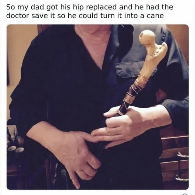 A person in a dark shirt holds a cane whose top handle is shaped like a human hip bone. The overlaid text reads: 'So my dad…