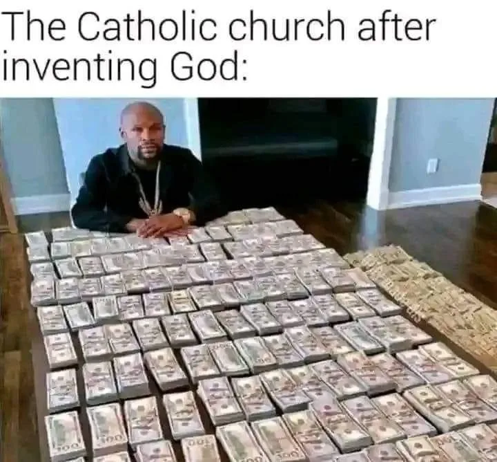 A man sits behind a massive spread of cash, including stacks of $100 bills and loose bills, implying immense wealth. The…