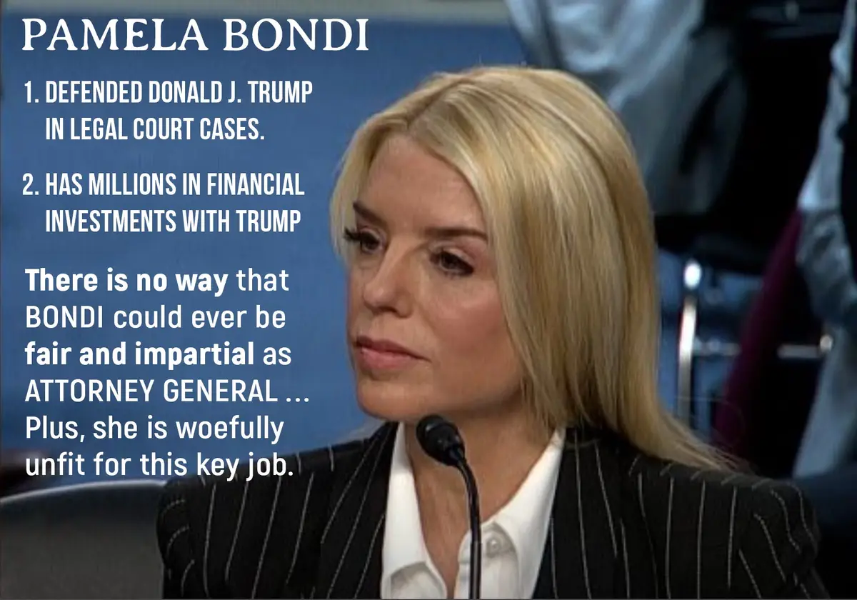 A woman with blonde hair wearing a pinstripe suit and white shirt sits before a microphone. Overlaid white text identifies…