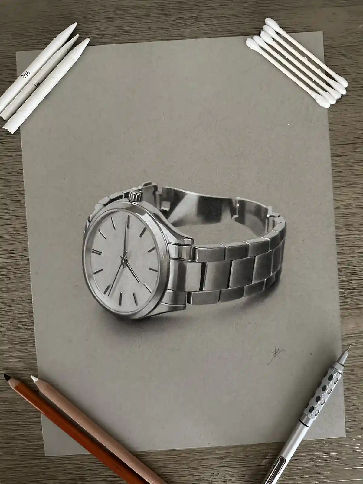 A highly realistic pencil drawing of a silver metal-link wristwatch on gray paper, surrounded by drawing tools including…