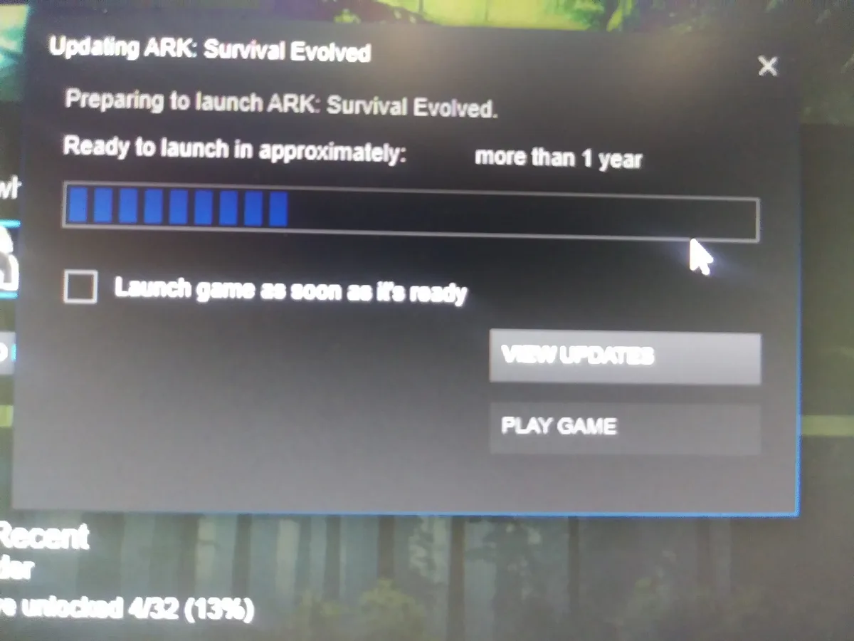 A screenshot of a game launcher window for ARK: Survival Evolved, showing a progress bar that is nearly full but with the…