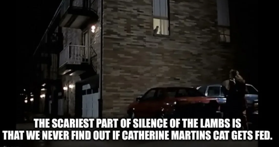 A nighttime scene from the movie 'Silence of the Lambs' showing a brick apartment building with a lit window, parked cars…