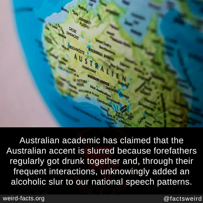 A close-up photo of a globe showing Australia labeled 'AUSTRALIEN' in German, with a black bar at the bottom containing…