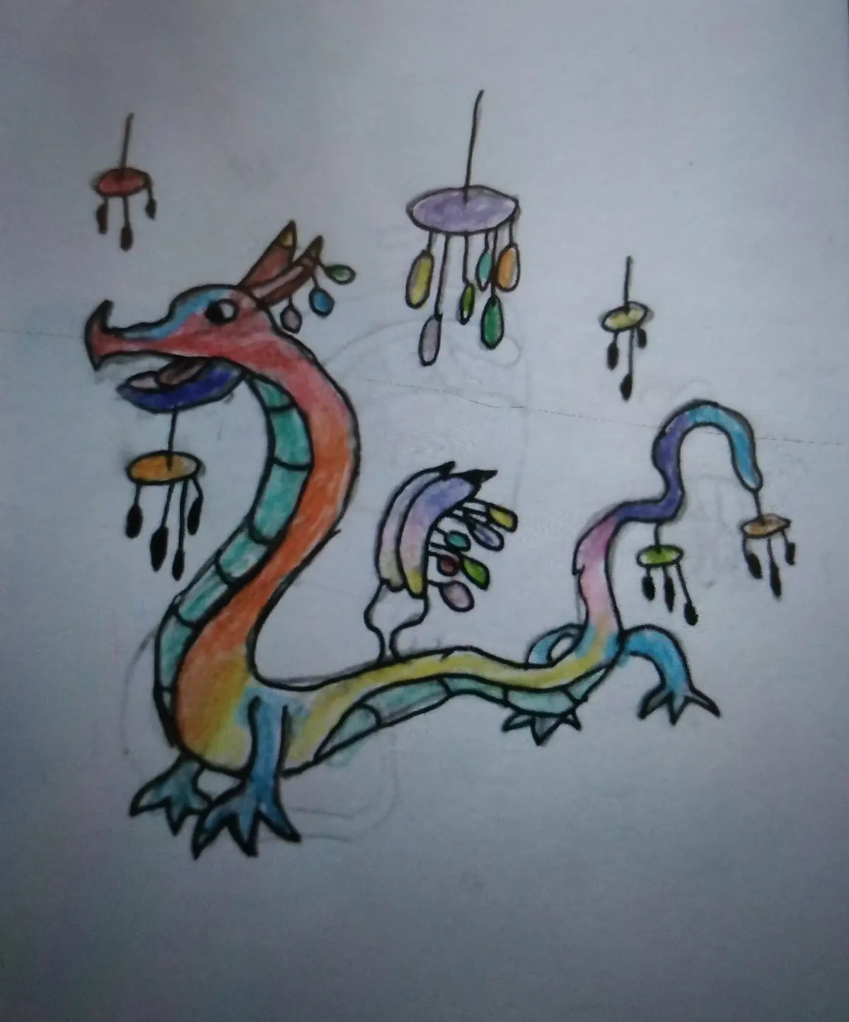 A colorful child's drawing of a dragon with multiple wind chimes attached to its body and hanging around it, implying it's…