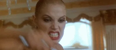 A six-panel image strip shows a woman with blonde hair and red lipstick in various angry expressions, including baring her…