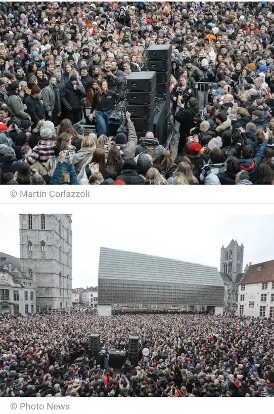 The meme juxtaposes two photos of the same outdoor concert venue. The top image shows a woman on a small stage surrounded by…