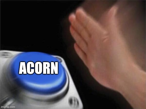 A blurry image shows a hand reaching toward a large blue button on a silver device, with the word 'ACORN' in bold white text…