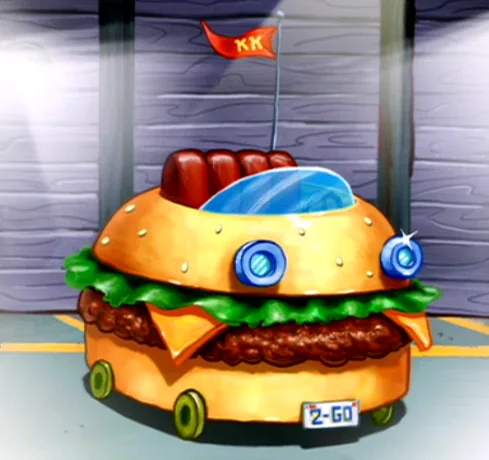 A cartoonish, anthropomorphic hamburger car with blue eyes, green lettuce, and a red flag with 'KK' on top, parked in front…
