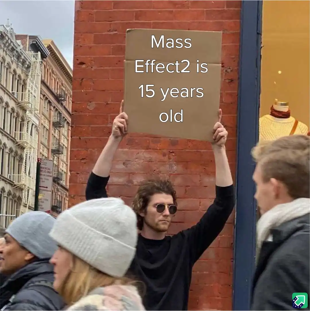 A man with curly hair and sunglasses holds up a cardboard sign that reads 'Mass Effect2 is 15 years old' while standing on a…