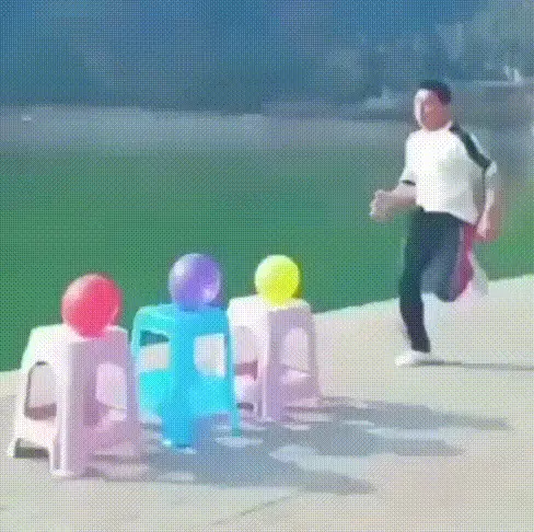 A six-panel image shows a man in athletic wear attempting to jump over colorful plastic stools with water-filled buckets on…