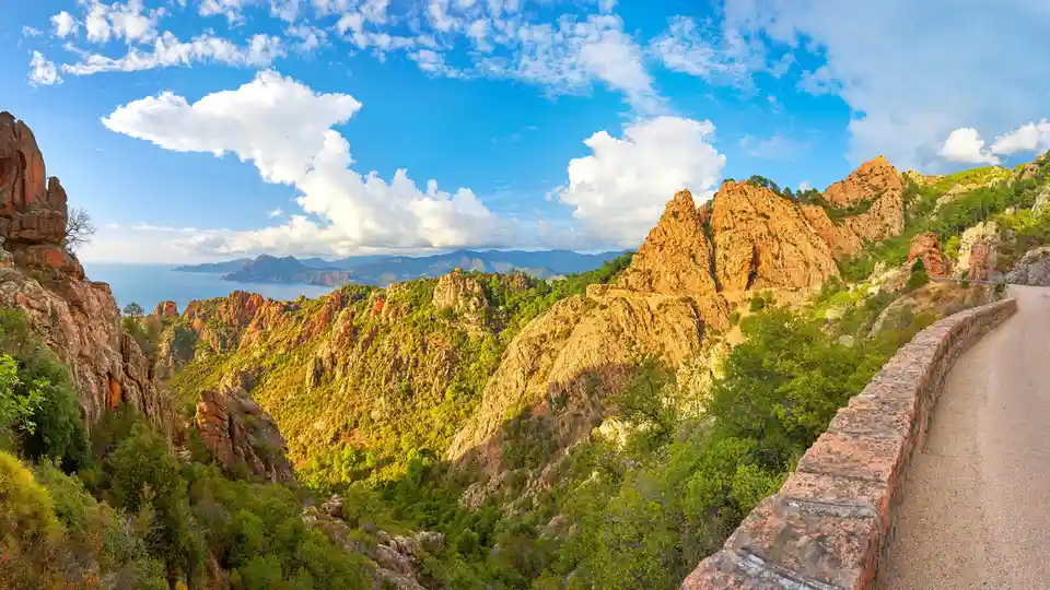 Corsica's Calanques de Piana, a UNESCO World Heritage Site since 1983, features rugged, rocky inlets with deep ravines cut…