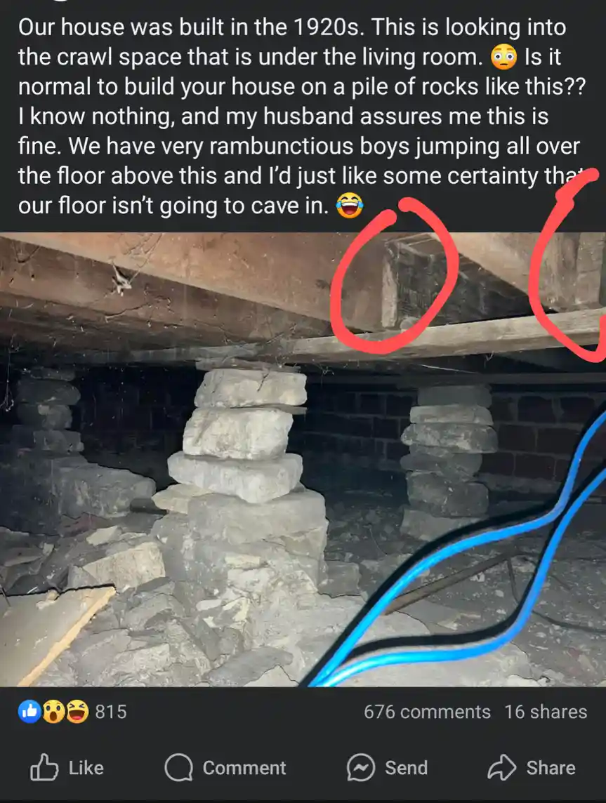 A photo of a crawl space under a house, showing large, stacked stones supporting the wooden floor joists. The overlaid text…