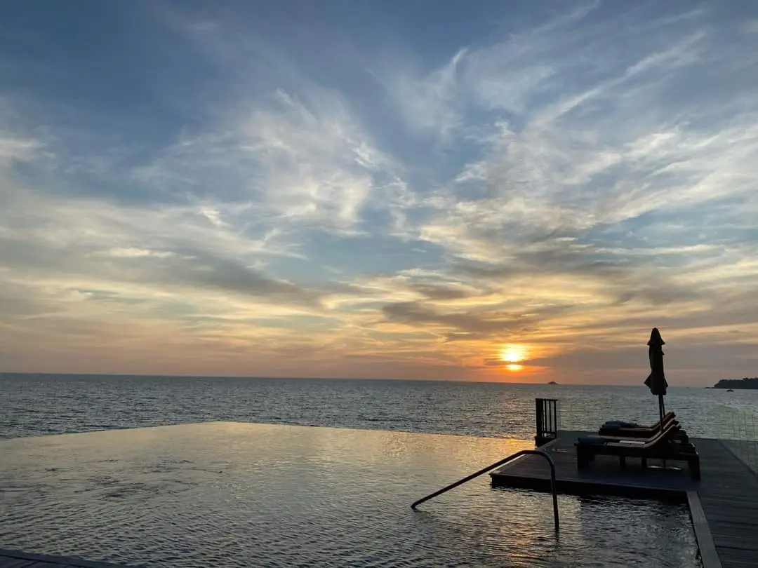 Stunning Sunset Over an Infinity Pool: Why Build a Pool by the Ocean?