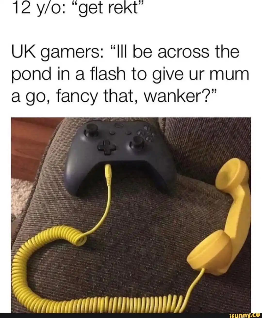 A black Xbox controller sits on a dark gray couch, with a bright yellow coiled telephone cord attached to it, ending in a…