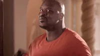 A six-panel image sequence shows Shaquille O'Neal in an orange shirt, transitioning from a confused, upward-looking…