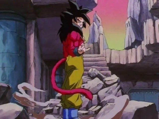 An anime character with spiky black hair, red and yellow gi, and a long red tail stands in a ruined stone environment with a…