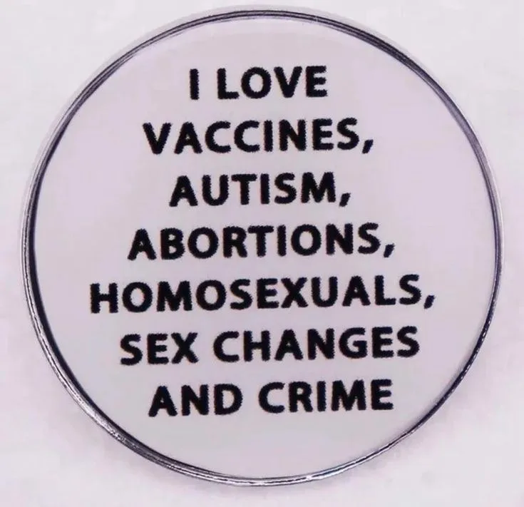 A circular white pin with a black border displays bold black text listing several controversial topics. The text reads 'I…