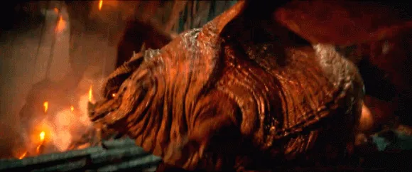A sequence of six frames shows a large, scaly, brown dragon-like creature collapsing and falling to the ground amidst smoke…