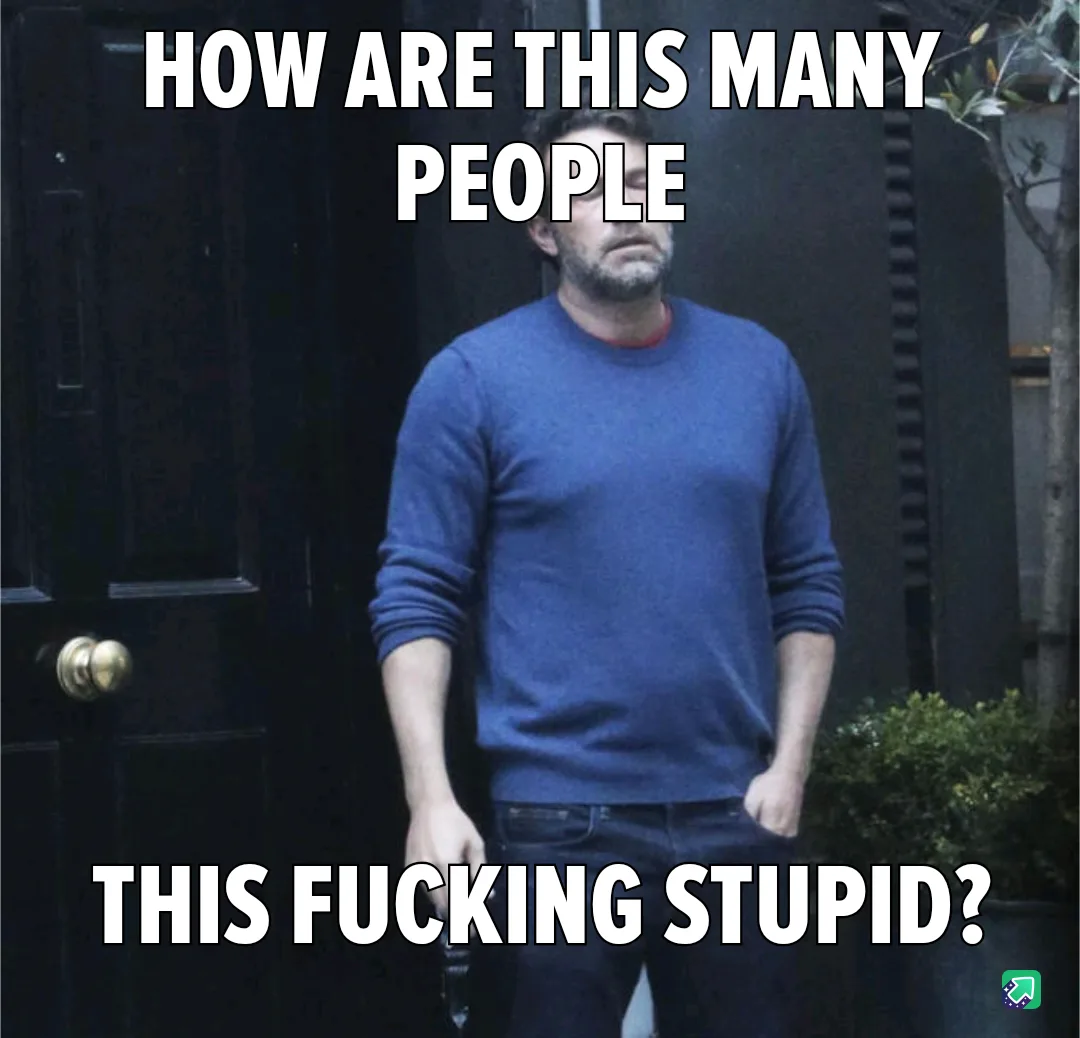 A man in a blue sweater stands in front of a dark door with a confused and slightly annoyed expression. The overlaid text…