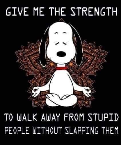 A black background features a cartoon dog, Snoopy, sitting cross-legged in a meditative pose with eyes closed and hands in…