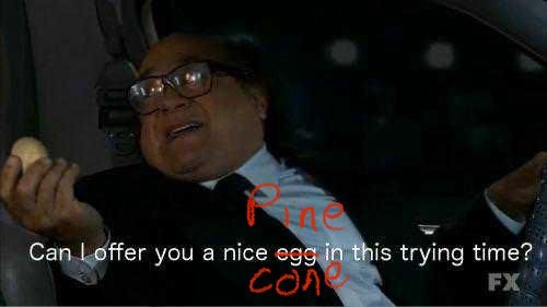 A man in a suit and glasses sits in a car at night, holding an egg, with red text overlaid that reads 'Pine cone' and white…