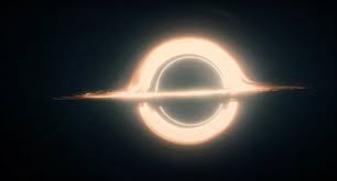 A realistic depiction of a black hole with a glowing accretion disk and event horizon, overlaid with the text 'i'm not a…