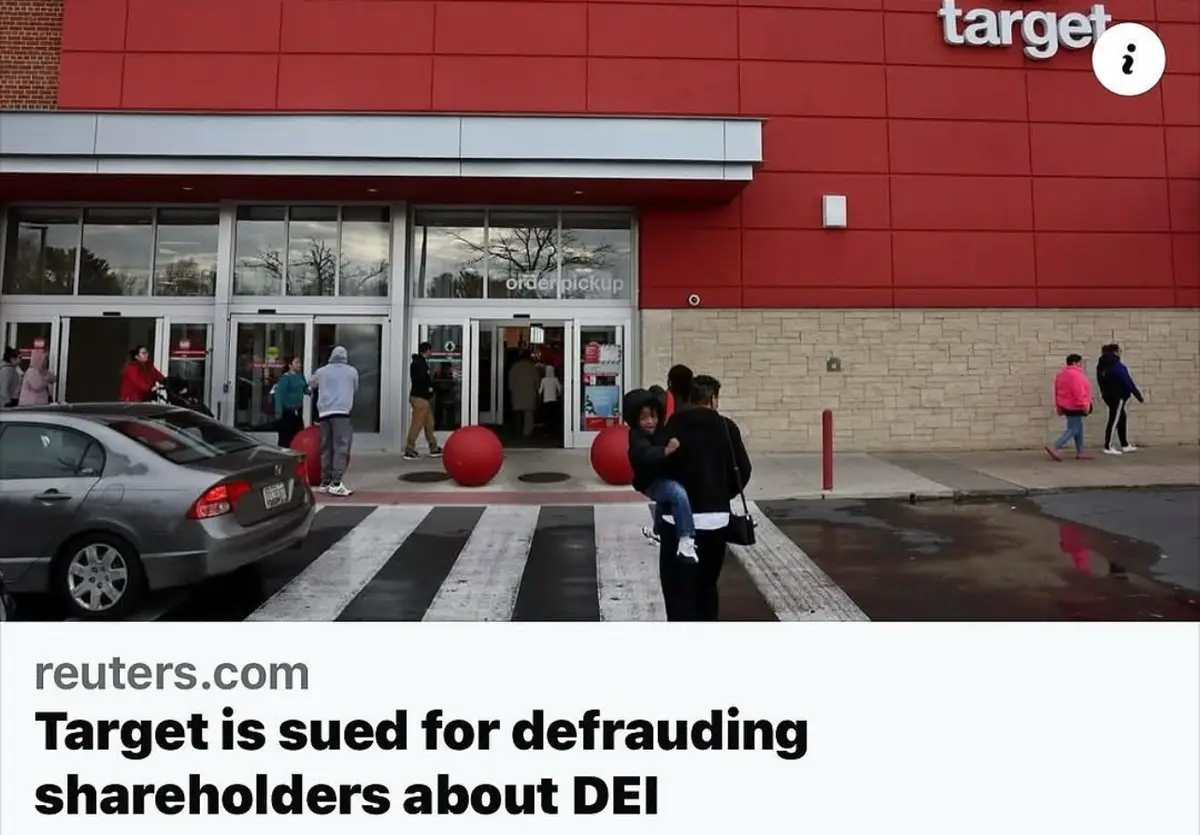 An outdoor photo of a Target store entrance with people walking around and a car parked nearby. The image has a Reuters.com…