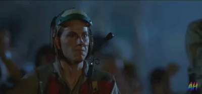 A still from a movie shows a man in a military-style helmet and uniform saluting. The image is repeated in a grid of six…