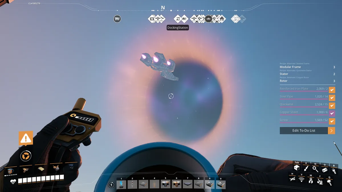 A first-person view from a space simulation game shows a player holding a control device, with a ship hovering near a…