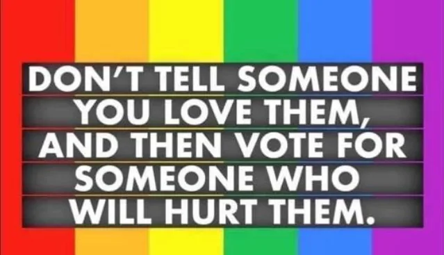 A rainbow flag background with a black signboard overlay displaying white text that reads: 'DON'T TELL SOMEONE YOU LOVE…