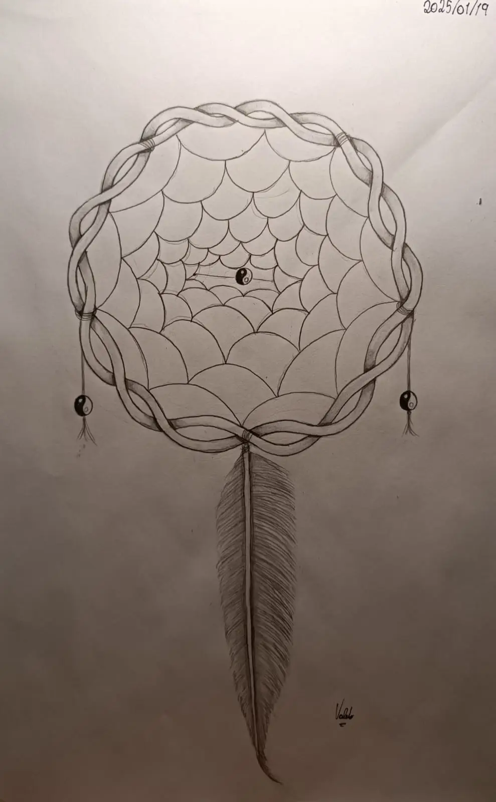 A pencil drawing of a dreamcatcher with a yin-yang symbol at its center and on its dangling beads, featuring a detailed…