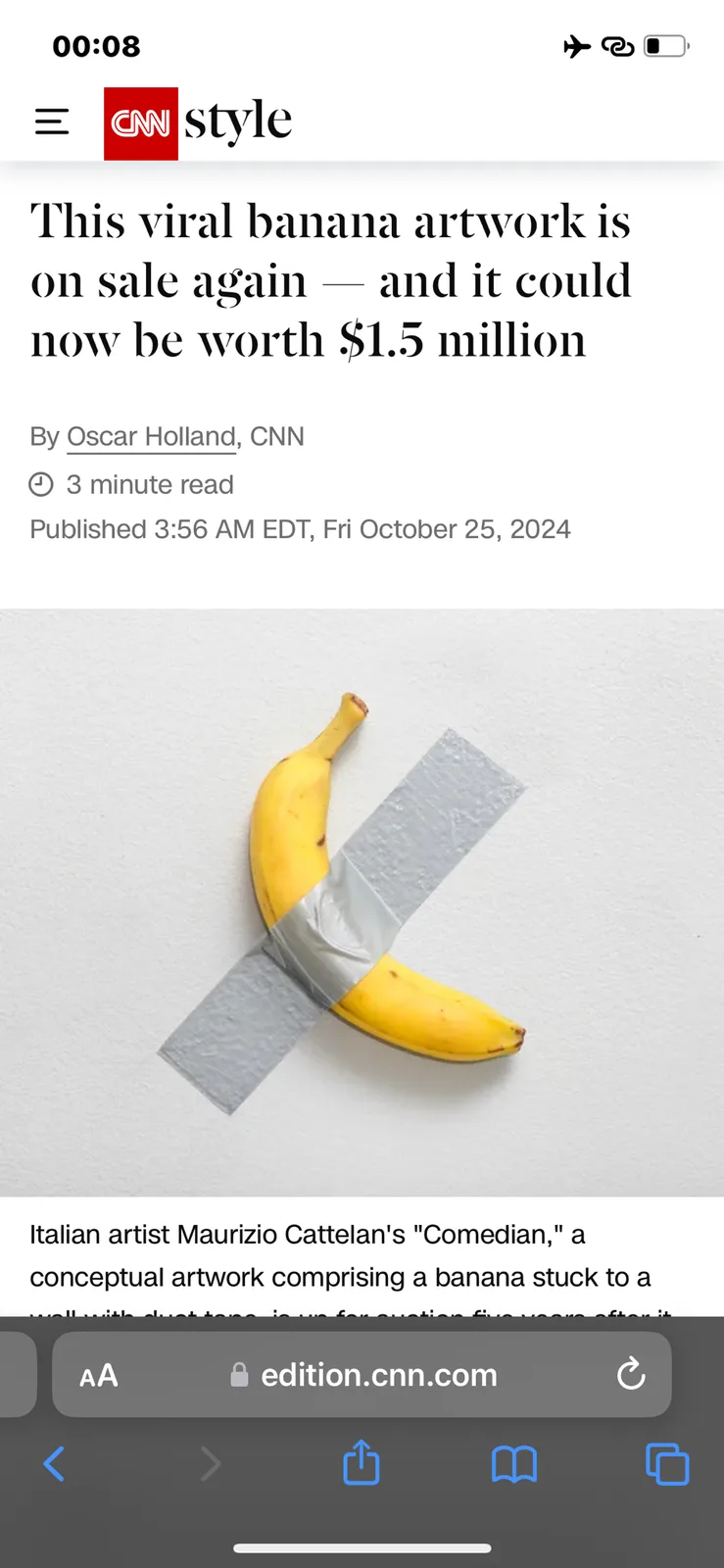A screenshot of a CNN Style article shows a yellow banana taped to a white wall with gray duct tape forming an 'X' over it…