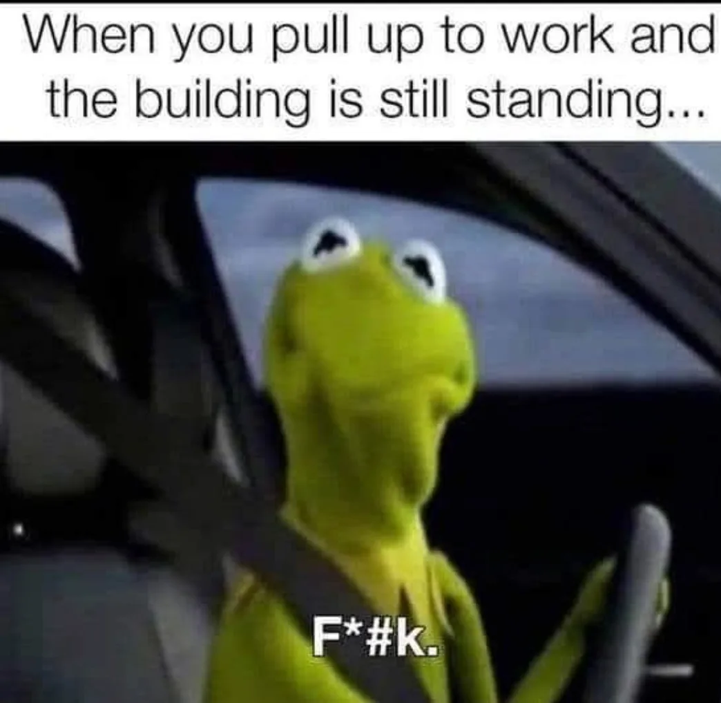 A green frog puppet, Kermit the Frog, is shown inside a car, looking upward with a shocked expression while wearing a…