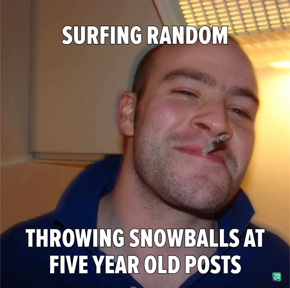 A man with a cigarette in his mouth and a smug, slightly squinted expression looks at the camera. He wears a blue collared…