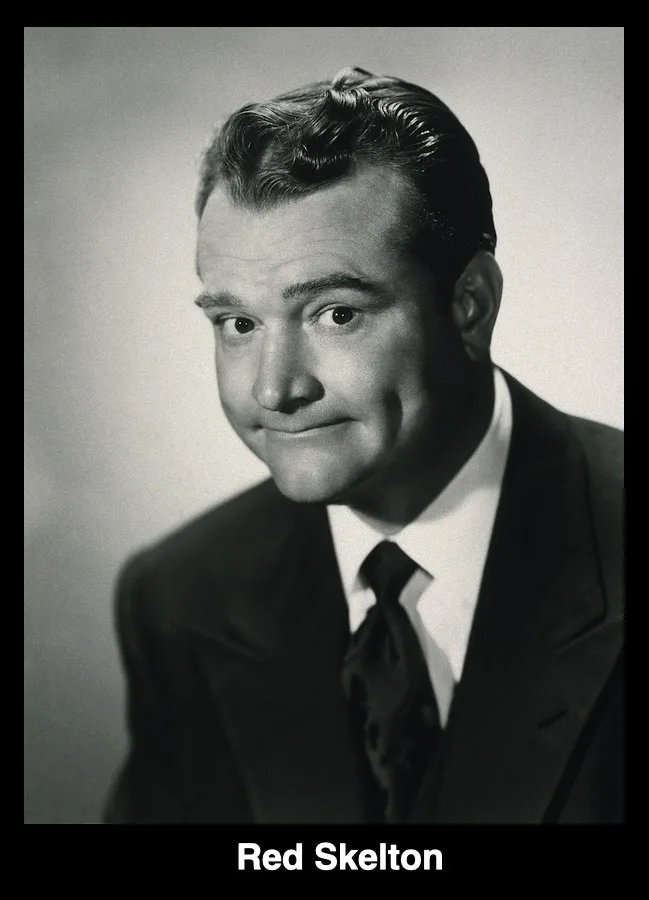 A black-and-white studio portrait of actor Red Skelton, who is wearing a suit and tie and looking slightly to his right with…