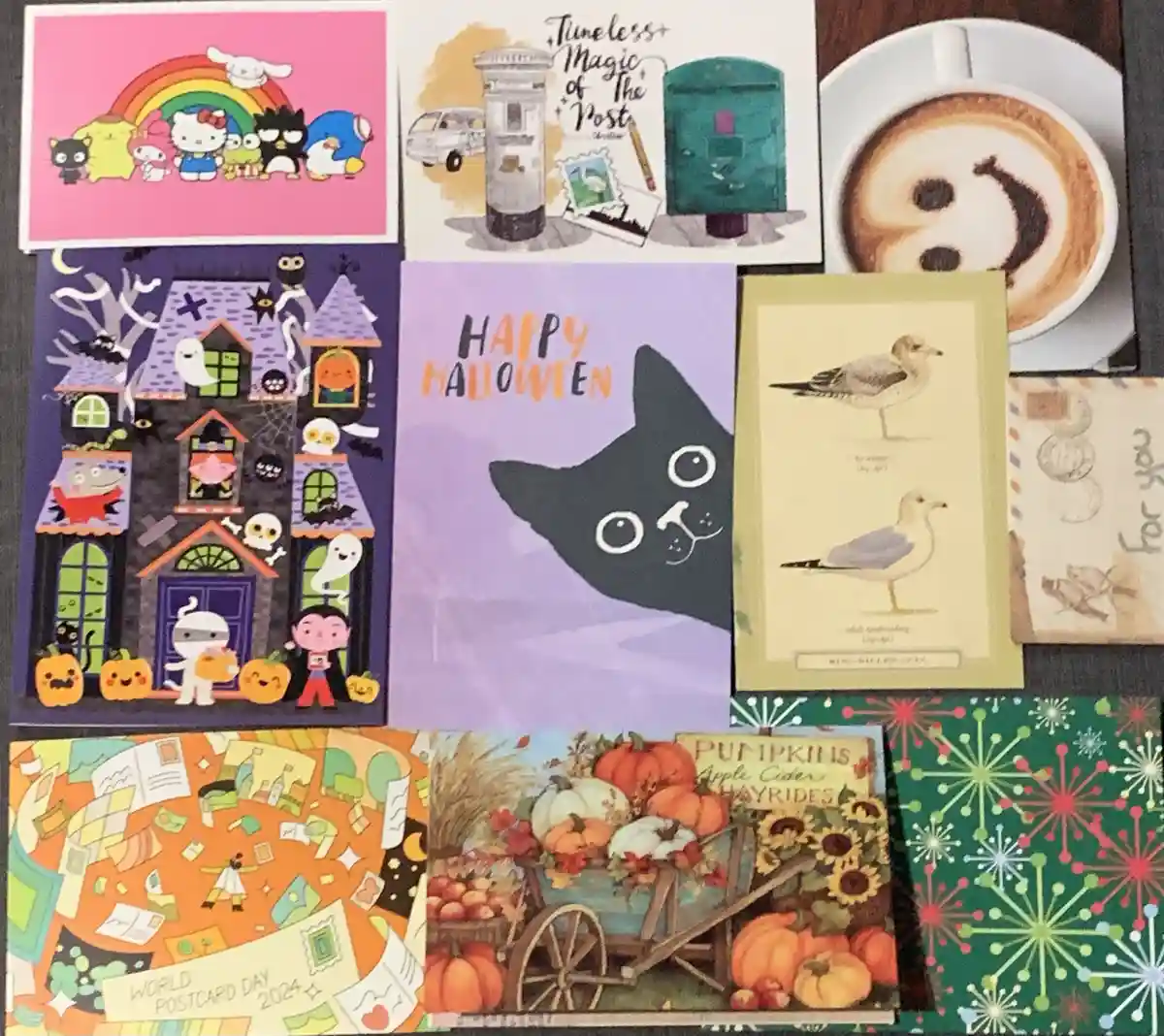A collage of various postcards and a coffee cup with latte art arranged on a surface. The postcards feature diverse themes…