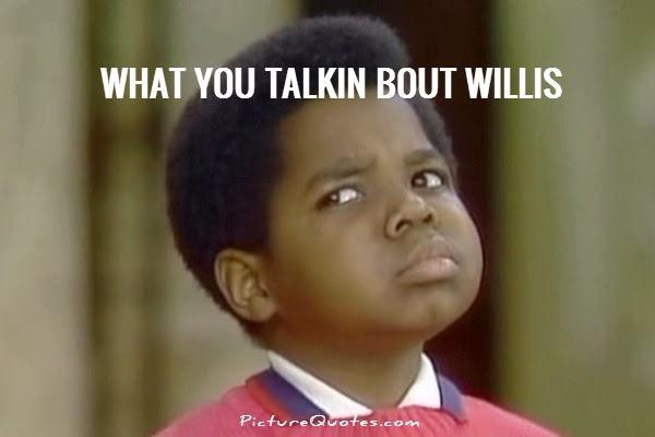 A young Black boy with short hair, wearing a red sweater over a collared shirt, looks upward with a skeptical, unimpressed…