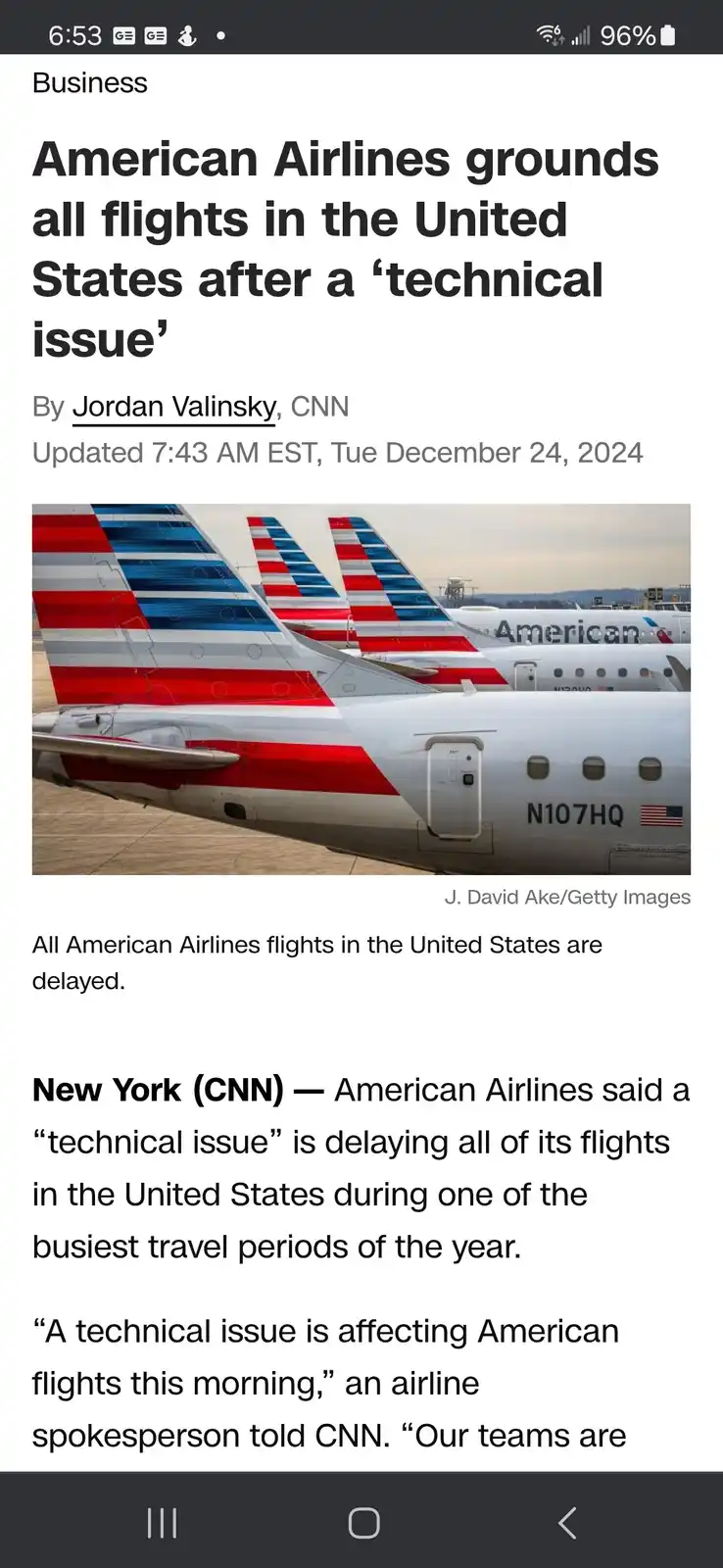 A screenshot of a CNN news article about American Airlines grounding all U.S. flights due to a 'technical issue,' featuring…
