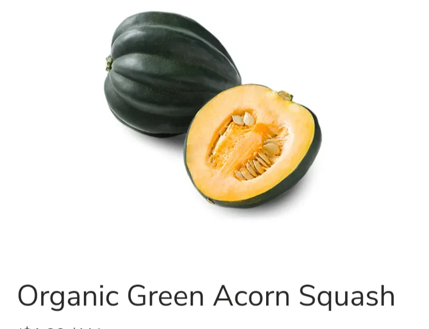 The image shows two acorn squash: one whole and dark green, the other cut in half revealing orange flesh and seeds. Text…