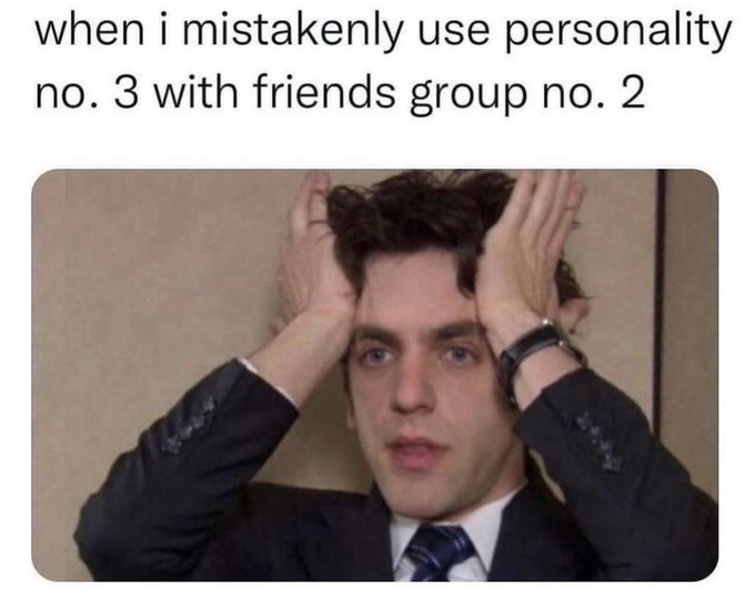 A man in a dark suit and tie, with his hands on his head in a gesture of frustration or panic, looking directly at the…