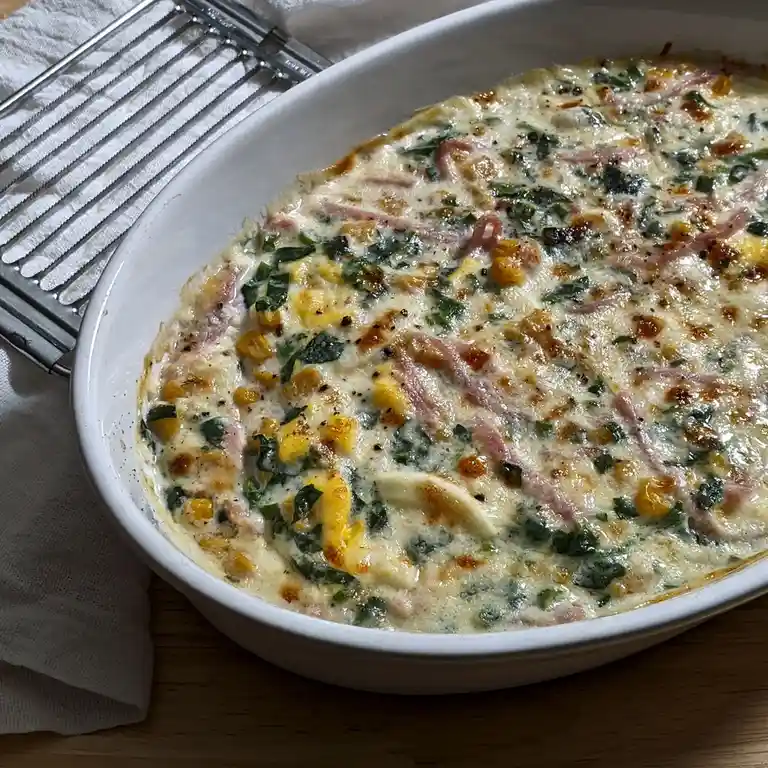 Delicious Eggs Gratin loaded with Corn, Spinach, and Ham!