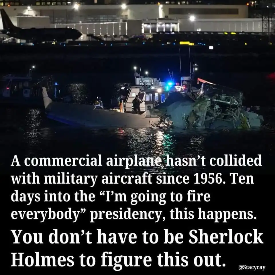 A nighttime photo shows a severely damaged commercial airplane submerged in water next to a rescue boat with flashing…