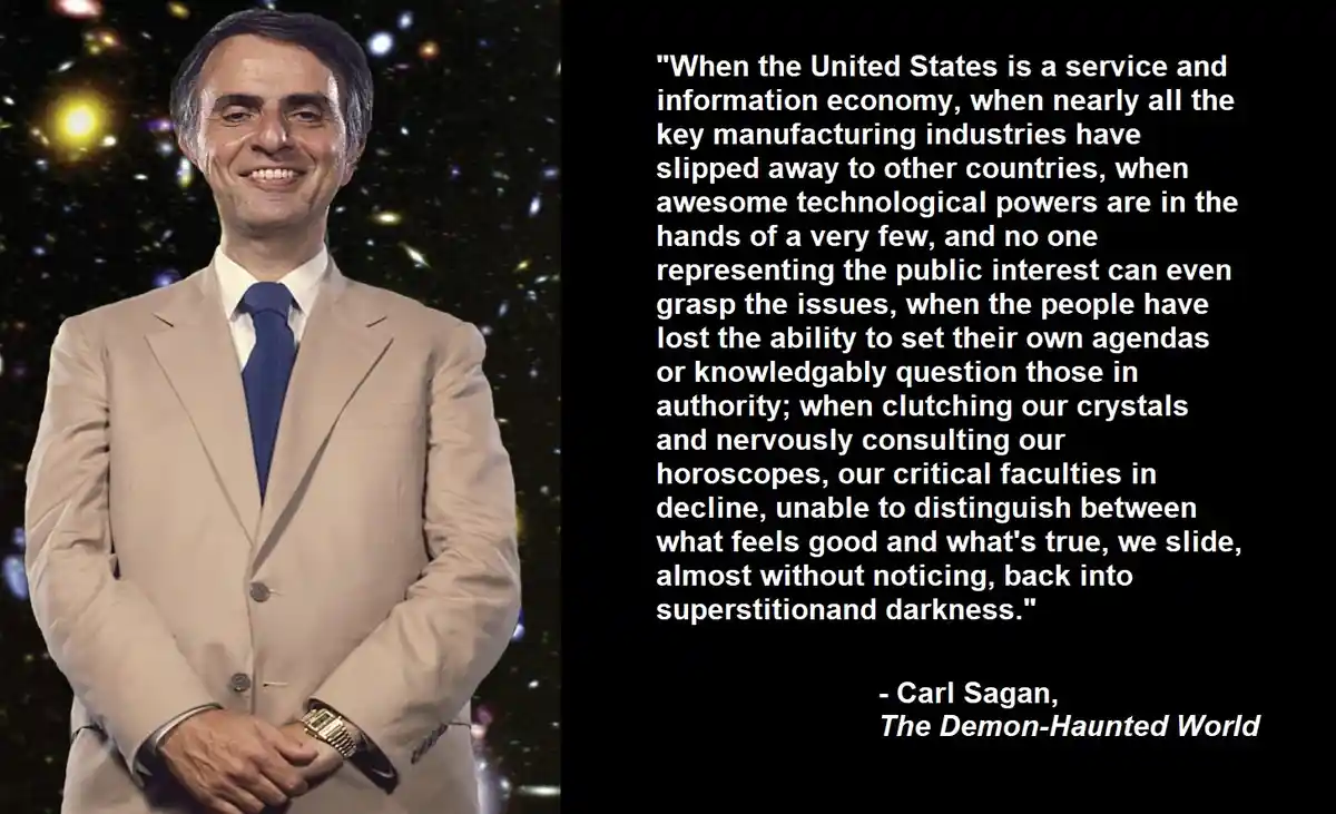 A man in a beige suit and blue tie smiles against a starry space background. Overlaid text is a long quote from Carl Sagan's…