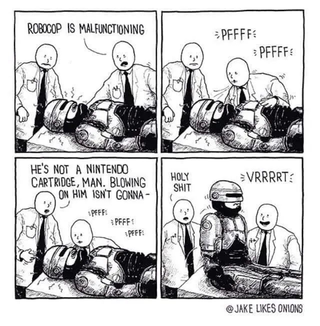A four-panel comic strip shows two bald, white-shirted men in a lab trying to fix a malfunctioning Robocop. In the first…