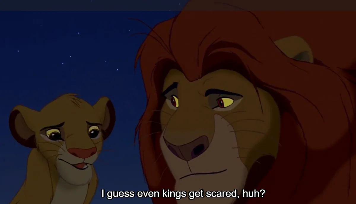 A still from Disney's 'The Lion King' shows young Simba looking up at his father, Mufasa, who has a worried expression. The…