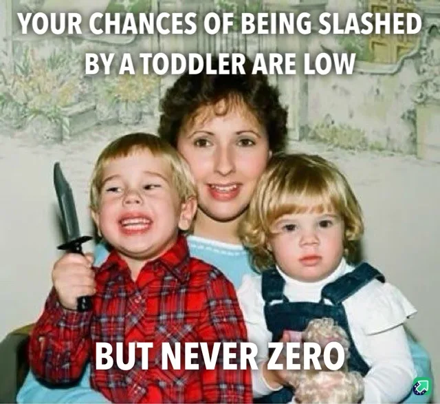 A vintage family photo shows a smiling woman with two young children. The boy on the left, wearing a red plaid shirt, holds…